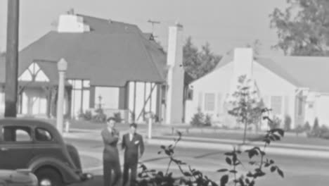 Suburban-Neighborhood-with-Vintage-Car-and-Two-Men-on-a-Sunny-Afternoon