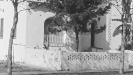 Black-and-White-Footage-of-a-Tranquil-Garden-With-Arched-Gateways-in-Daytime