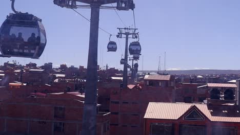 Teleferico-cable-cars-POV-from-inside-gondola-over-La-Paz,-Bolivia