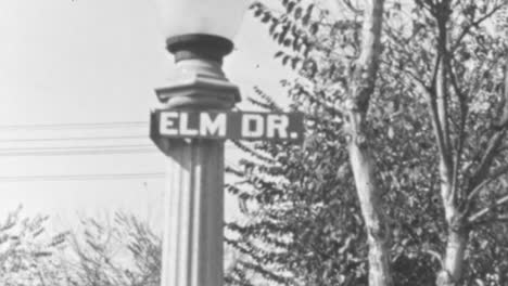 Elm-Drive-Street-Sign-Perched-Upon-a-Classic-Post-in-Suburban-Area-at-Daytime