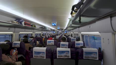 Step-inside-a-train-cabin-for-a-real-time-journey-between-Nanjing-and-Shanghai,-capturing-the-comfort-and-scenery