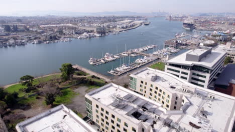 Oakland-California-USA-Waterfront,-Aerial-View-of-Marina,-Boats-and-Buildings-on-Sunny-Day