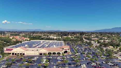 Sideways-Drone-View-Right-To-Left-in-Front-of-Costco-in-Temecula-California-along-Ynez-Road-view-of-the-valley-and-hills-in-behind-with-residential-areas-visible