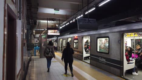 Establishing-of-Subway-of-Buenos-Aires-City-Station,-Line-A,-local-people-travel-seated-and-walking-in-Loria-Station,-Almagro-neighborhood