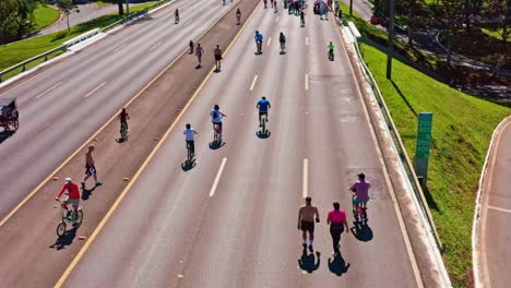 Relaxing-Cycling-and-Walking-Along-Lanes,-Pull-back-Aerial