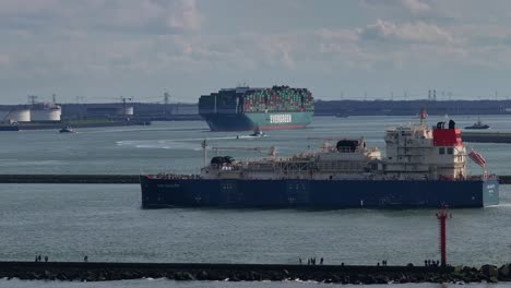 Gas-Agility-Ship-Cruising-Through-The-River-In-Hoek-van-Holland,-Netherlands---Drone-Shot