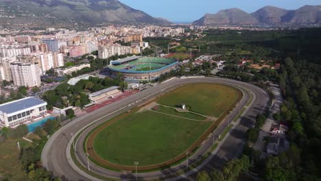 Drone-Orbits-Above-Palermo-FC-Stadium-Renzo-Barbera-and-Ippodromo-della-Favorita,-Horse-Racetrack