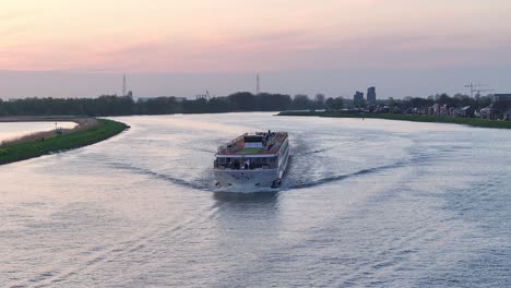 Ship-Monarch-Queen-Cruising-On-Canal-River-Of-Hendrik-Ido-Ambacht-In-Netherlands---Drone-Shot