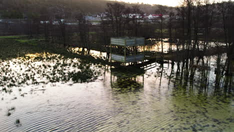 Birdwatching-Tower-Inundated-With-Water-,Aerial-Pullback,-Gothenburg