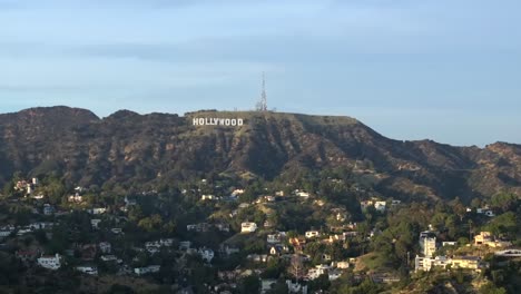 Aerial-Drone-Over-Hollywood-Hills-Famous-White-Letter-Hollywood-Sign-On-Hill,-Los-Angeles-California-USA