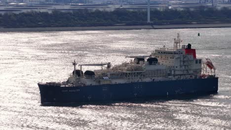 Gas-Agility-LNG-Bunker-Vessel-Sailing-on-Glistening-Water-Along-Hoek-van-Holland,-Netherlands