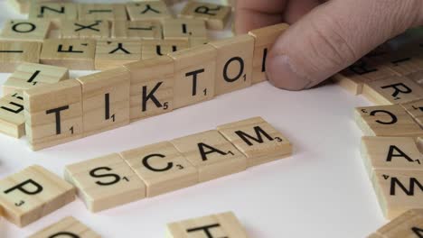 Words-TIKTOK-and-SCAM-from-social-media-formed-with-Scrabble-letters