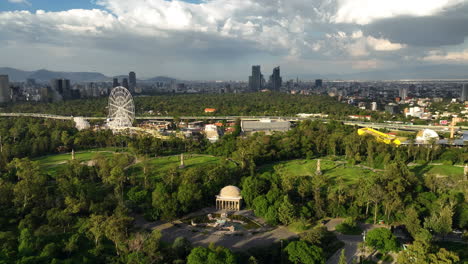 Aerial-view-circling-the-Aztlan-Park,-golden-hour-in-Chapultepec,-Mexico-city