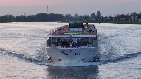 Monarch-Queen-Cruising-River-In-Hendrik-Ido-Ambacht,-Netherlands---Drone-Shot