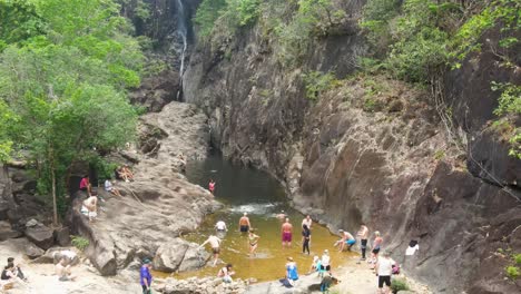 Aerial-View-Of-Tourists-Enjoying-Creek-At-Khlong-Phu-Waterfall