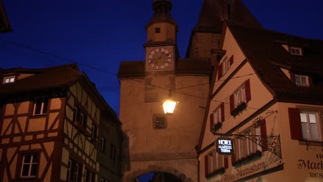 Rothenburg-at-night,-with-lantern-and-clock-tower