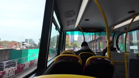 POV-Sitting-On-Upper-Level-Of-Double-Decker-Bus-Driving-Through-London