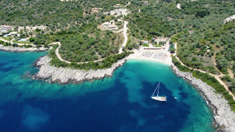 Aerial-Panoramic-view-of-Ammoussa-Beach-Bay,-Sailing-Boat,-Lefkada,-Greece