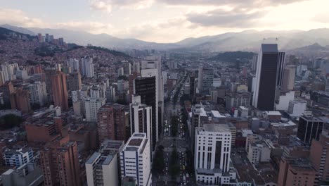 Dusk-descends-on-the-bustling-skyline-of-Medellín,-Colombia---aerial