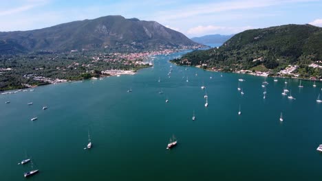 Revealing-Aerial-of-Nidri-Town-and-Vlicho-Bay,-Lefkada,-Greece