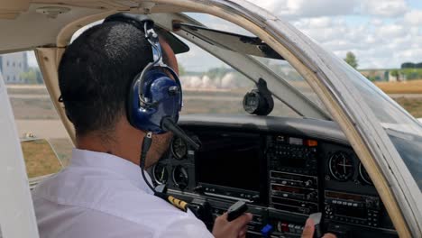 A-pilot-going-over-the-checklist-before-takeoff