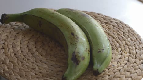 Showing-two-banana-plantain-on-a-turning-table,-fast-forward