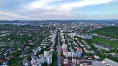 Aerial-view-captured-from-drone-over-city-of-Iasi-from-Romania-with-buildings,-trees-and-traffic-during-an-afternoon