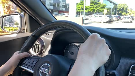 Hands-on-Car-Steering-Wheel-in-Driving-School,-Close-Up