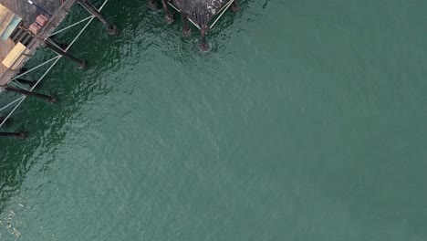 Oceanside-California-Pier-Fire-Damaged-Former-Rubys-Diner-Restaurant-Drone-Flyover-Straight-Down-View-Northeast-To-Southwest-Corner