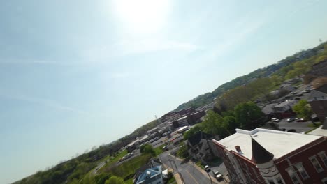 FPV-drone-flight-around-small-american-town-with-historic-buildings-during-sunny-day