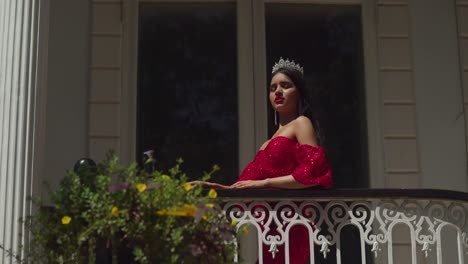 Amidst-the-antiquity-of-a-Caribbean-castle,-a-young-woman-in-a-crimson-gown-exudes-elegance