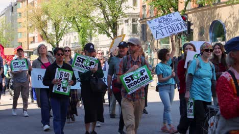 Crowd-of-activists-with-banners-marching-for-environmental-protection-in-Stockholm