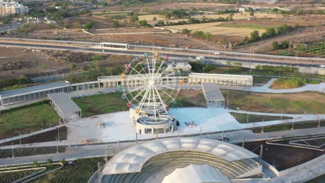 The-drone-camera-moving-forward-shows-the-area-surrounding-the-Giant-Will-with-small-farms-and-vehicular-traffic-on-the-highway