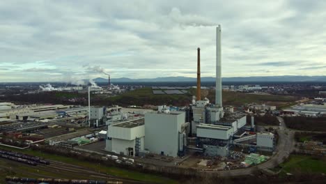 Power-Station-Chimney-Fumes-at-Industrial-Park,-Drone-Shot