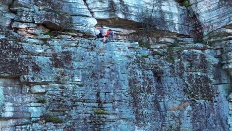 An-aerial-view-of-mountain-climbers-enjoying-their-climb-to-the-top-on-a-sunny-day