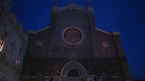 Majestic-night-view-of-Basilica-dei-Santi-Giovanni-e-Paolo,-showcasing-Gothic-architecture-under-a-starlit-sky-in-Venice,-Italy