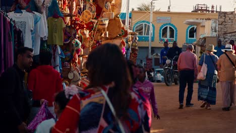 Busy-market-street-in-Nubian-Village,-Aswan,-Egypt