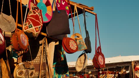 Traditional-style-handmade-hand-bags-displayed-at-local-traditional-craft-shop-in-market-street-of-Nubian-Village,-Egypt