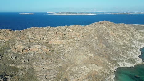 Aerial-footage-of-Paros'-coastline,-one-of-the-many-Cyclades-Islands-in-the-Aegean-Sea
