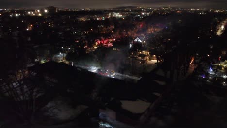 Firefighters-fire-engine-extinguish-school-building-fire-Montreal-Canada-aerial