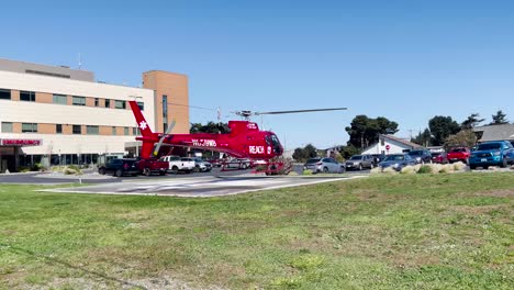 Cal-Ore-Life-Flight-Medical-Emergency-Rescue-Helicopter-Taking-Off-from-Gold-Beach-Hospital,-Oregon