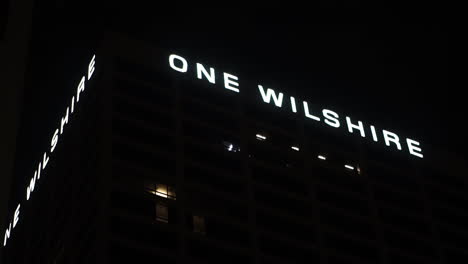 One-Wilshire-Tower-in-Downtown-Los-Angeles-USA-at-Night,-Low-Angle