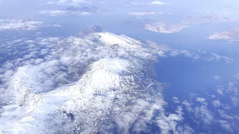 Snowy-lofoten-islands-in-norway-with-clouds,-aerial-view