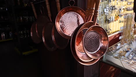 Hanged-copper-cookware-in-a-market-at-Michoacan