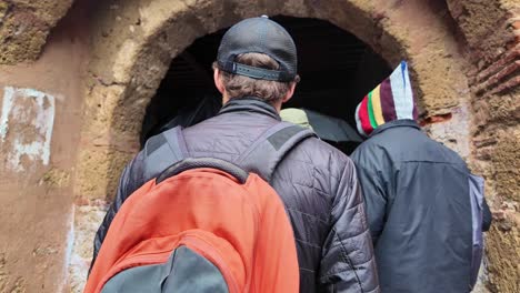 Entering-the-medina-of-Chefchaouen,-Morocco-city-walls-POV-excursion