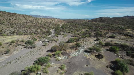 Garbage-Strewn-Along-the-Roadside-Ruins-the-Beauty-of-the-Desert-in-Mulege,-Baja-California-Sur,-Mexico---Aerial-Drone-Shot