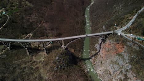 Aerial-view-of-the-Tara-Bridge-in-Montenegro-with-passing-cars,-which-is-part-of-an-important-road-between-Belgrade-and-Podgorica