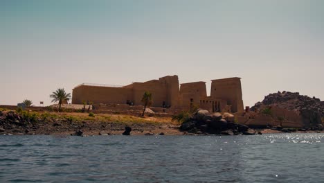boat-view-of-Philae-temple-complexin-the-reservoir-of-the-Aswan-Low-Dam,-downstream-of-the-Aswan-Dam-and-Lake-Nasser,-Egypt