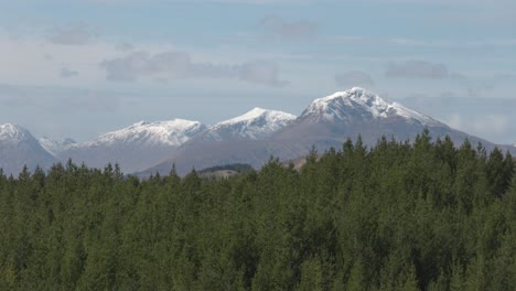 Slow-panning-shot-of-snow-covered-mountaintops-in-the-Scottish-Highlands