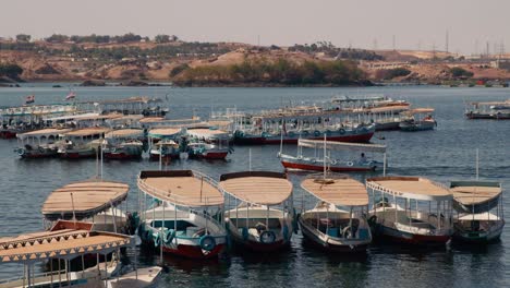 boat-entering-the-bay-after-a-guided-tour-in-Aswan-Dam-and-Lake-Nasser,-Egypt-visit-the-Philae-temple-complex-island